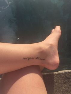 a woman's foot with the words you are loved written on her left leg