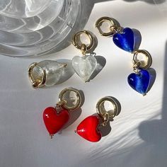 These pretty glass heart earrings will take your breath away.  Gold plated hoop earrings with a Murano Glass heart.  Size of Heart: approx. 2cm Handmade in Greece Glass Hoop Earrings Gift, Glass Hoop Earrings For Gift, Glass Hoop Earrings As Gift, Glass Jewelry With Heart Charm For Valentine's Day, Heart-shaped Earrings With Charms For Valentine's Day, Clear Hoop Earrings For Pierced Ears As Gift, Heart-shaped Charm Earrings For Valentine's Day, Gift Hoop Earrings With Heart Beads, Heart-shaped Glass Jewelry For Valentine's Day