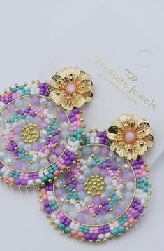 These handbeaded Eternal Flower Earrings add a touch of whimsy and charm to any outfit. With delicate pastel hues, they are sure to catch the eye and become a staple in your jewelry collection. Perfect for adding a playful touch to your wardrobe, these earrings are a must-have! Multicolor Bohemian Earrings With Flower Charm, Bohemian Multicolor Earrings With Flower Charm, Adjustable Multicolor Flower Charm Earrings, Adjustable Multicolor Earrings With Flower Charm, Multicolor Flower Charm Drop Earrings, Pink Dangle Flower Earrings With Colorful Beads, Multicolor Beaded Flower Earrings For Spring, Spring Multicolor Beaded Flower Earrings, Bohemian Pink Earrings With Flower Charm