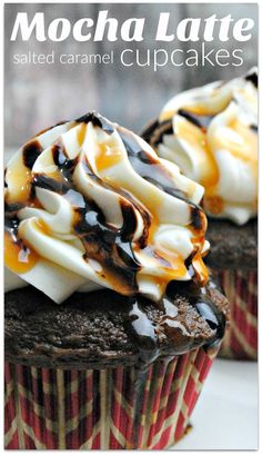 two chocolate cupcakes topped with whipped cream and caramel drizzle