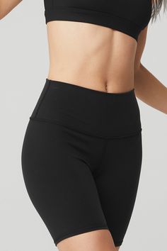 Meet the ultimate short for practice and pavement: the High-Waist Biker Short, made in our signature lifting, sculpting Airbrush fabric, with a high waist, moisture-wicking technology and 4-way stretch that moves with you. Equal parts forward and functional. Wear with a fave bra layered under a cute cropped hoodie or pair with an Alo statement tee. Sculpts, lifts & smooths! On-trend high waist Designed & uniquely fit to flatter every size Wear-tested by our in-house team for the perfect fit 7" H Alo Yoga 4-way Stretch Elastane Bottoms, Functional High Waist Black Bottoms, Black Leggings With Built-in Shorts For Yoga, Black Workout Bottoms With Built-in Padding, Fitted Moisture-wicking Bottoms By Alo Yoga, Black Moisture-wicking Elastane Biker Shorts, Alo Yoga Fitted Moisture-wicking Bottoms, Black Mid-thigh Length Elastane Activewear, Alo Yoga Athleisure Bottoms With Built-in Shorts