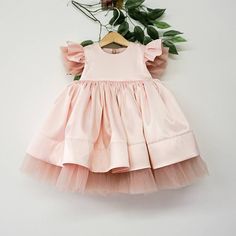 "This beautiful dress in blush pink is made for first birthday celebration, wedding parties, smash cake photoshoot and other formal events. We make dresses in standard sizes and by individual measurements. If your measurements differ from those below please send us your measurements in order note. Always feel free to contact us if you have any questions! SHIPPING We ship worldwide. Processing time for making your order is 3-5 business days. Standard USPS shipping takes 12-16 days, upgrade (expre Birthday Ruffled Princess Dress With Short Sleeves, Birthday Princess Dress With Ruffles And Short Sleeves, Summer Princess Baptism Dress With Short Sleeves, Summer Princess Style Baptism Dress With Short Sleeves, Elegant Pink Tutu Dress For First Birthday, Princess Dress With Short Sleeves For First Birthday, Princess Style Dress With Short Sleeves For First Birthday, Short Sleeve Princess Dress For First Birthday In Spring, Elegant First Birthday Summer Tutu Dress