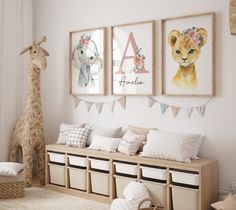 a nursery room with three pictures on the wall