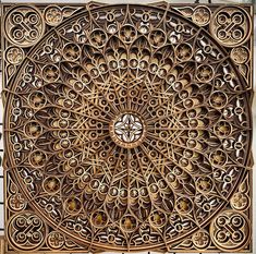 an intricately carved wooden panel with circular designs