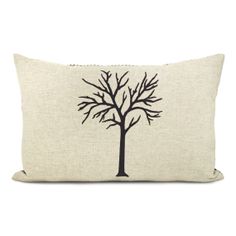 a pillow with a blue tree on the front and back side, sitting on a white background