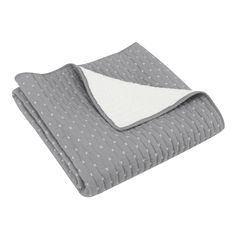 a grey blanket with white stars on it