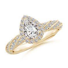 a yellow gold engagement ring with an oval cut diamond surrounded by round brilliant pave diamonds