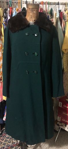 Beautiful 1950s Shagmoor hunter green wool coat with mink collar. This coat is really lovely. It is double breasted closure with an architectural design detail across the chest. It has pockets, which is always a plus. The collar can be worn down or close to the neck and held by a hook and eye. The lining is silk. It's in wonderful vintage condition with no major issues. MEASUREMENTS (taken flat, double when appropriate) Bust 20 waist 18 length 40 This is the perfect unique gift for a loved one, Winter Coat With Fur, Coat With Fur Trim, Green Winter Coat, Green Wool Coat, Over Coat, Coat With Fur, Coat Winter, Ribbed Turtleneck, Green Wool