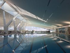 an empty swimming pool in the middle of a large building