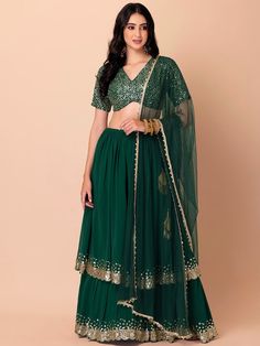 Introducing our amazing green sequins georgette reception wear lehenga choli, a stunning ensemble designed for those special occasions that deserve nothing but the best. This exquisite lehenga choli set will make you the center of attention at receptions, weddings, festivals, and parties, ensuring you look effortlessly stylish and elegant.
Crafted with precision and attention to detail, this green lehenga features a beautiful georgette material that drapes gracefully, enhancing your silhouette. Green Chinon Sharara For Party Wear, Anarkali Green Lehenga With Sequins, Green Sequined Palazzo Set For Eid, Designer Green Sequined Lehenga, Green Georgette Party Wear Sets, Festive Green Lehenga With Sequins, Green Chinon Party Wear Sets, Festive Green Palazzo Set With Sequins, Festive Green Sequined Lehenga