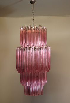 a pink chandelier hanging from the ceiling