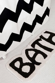 black and white chevroned bedding with the word bora written on it