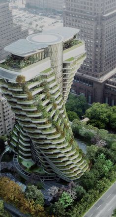 an aerial view of a tall building in the middle of a city with trees growing on it