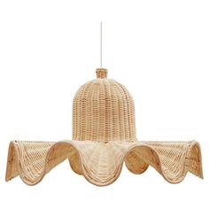 a wicker light hanging from the ceiling