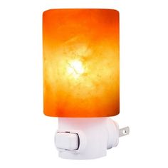 a light that is on top of a white wall mounted outlet with an orange glass shade