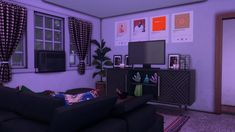 a living room filled with furniture and lots of pictures on the wall next to a flat screen tv