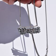 Customize your style and capture memories with our Nameplate Necklace. Made from sterling silver, personalize your nameplate for a unique touch. Honor loved ones, celebrate special moments, or show your love for pets with hand-sawed letters. This necklace goes beyond an accessory, representing your individuality and special moments. Make a personal statement with our Nameplate Necklace. Hand- sawn out of two thick sterling silver sheets hanging off of a rhodium-plated Miami Cuban link chain. Ava Miami Cuban Link Chain, Miami Cuban Link, Nameplate Necklace, Hand Saw, Miami Cuban, Personal Statement, Capture Memories, Cuban Link Chain, Cuban Link