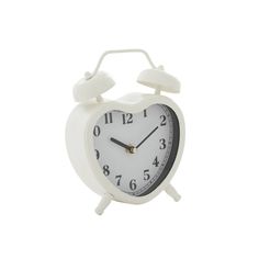 a white alarm clock with two hands and numbers on the face, against a white background