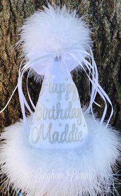 THIS IS A SOLID WHITE BEAUTIFUL HAT WITH SILVER METALLIC WRITING, the lighting was really bad, it is really an adorable hat in person!  This listing is for a  Boutique quality Monogrammed Birthday Hat for your little sweetie,  boy or girl.   These are excellant quality, padded, covered, and the embroidered with your choice of colors!  Your little doll  will be the hit of the party,  you can't get anymore original than this.    Super for a keepsake for years to come!   There are lots of hats out there, but none with this much embroidery and personalization.  I have any thread color.   Bridal Satin colors on cone, available are:  white, red, hot pink, light pink, light purple, black, light blue, aqua, and lime green.    Maribou trim  colors are candy pink, bright fuschia, bright hot pink,  l Customizable White Hat For Birthday, White Adjustable Mini Hat For Birthdays, Adjustable White Mini Hat For Birthdays, White Adjustable Mini Hats For Birthday, Adjustable White Mini Hat For Birthday, White Birthday Party Hat Supplies, New Years Birthday Party, Baby Birthday Hat, New Years Birthday