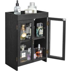 an open cabinet with bottles and perfumes in it