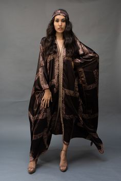 This lightweight kaftan dress  is perfect for lounging by a poolside or just to  throw on to wear all day. Elegant V-neck Kaftan With Dabka, Elegant Brown Thobe For Eid, Tunic Dress With Dabka For Eid, Dabka Tunic Dress For Eid, Eid Tunic Dress With Dabka Details, Maxi Length Kimono For Eid Wedding, Maxi Length Wedding Kimono For Eid, Traditional Kaftan With Kimono Sleeves For Party, Elegant V-neck Festive Kimono