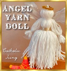 an angel yarn doll sitting on top of a table