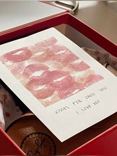 a card in a red box that says kiss for only you and i love you