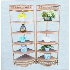 three wooden shelves with vases and flowers on them