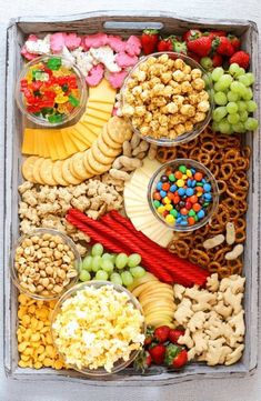 a box filled with lots of different types of snacks and treats on top of each other