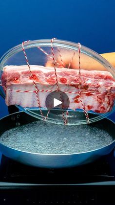 a piece of meat is being cooked in a pan on top of an electric stove