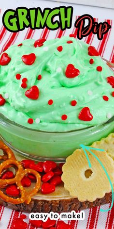 a green dip surrounded by pretzels, pretzel crackers and candy canes