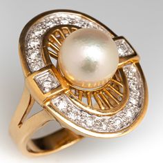 This radiant ring features an oval shaped gallery accented with one (1)  saltwater Akoya pearl, and a halo of twenty (20) bead set round brilliant cut diamond accents. The ring measures 21.6mm at the top, rises 10.7mm above the finger, tapering to 3.0mm wide and 1.0mm thick at the base of the shank.   It is crafted in 18k yellow gold and is currently a size 4.75.  The ring matches perfectly with the earrings under sku ab73326. Timeless Diamond Pearl Ring With Center Stone, Timeless Pearl Ring With Diamond Accents, Luxury Oval Pearl Ring With Center Stone, Oval Diamond White Pearl Ring, Oval Diamond White Pearl Ring With Diamond, Oval Diamond Pearl Ring In Diamond White, Timeless Oval Pearl Ring With Brilliant Cut, Formal Diamond Pearl Ring With Halo Design, Formal Pearl Ring With Diamond Halo Design