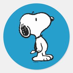 a cartoon snoopy dog sitting on the ground with its mouth open and tongue out