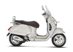 a white scooter is shown on a white background