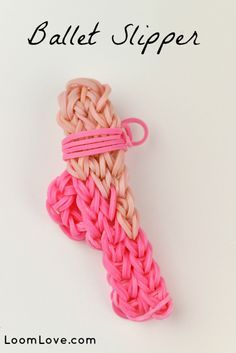 a pink and white crocheted object with the words ballet slipper on it