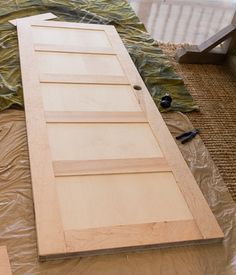 the unfinished door is being made and ready to be hung on the wall in the living room