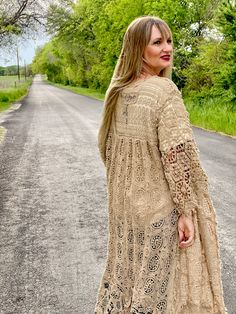 Embrace timeless fashion with The Dixieland Duster. This one-size crochet duster adds a statement piece to any outfit with its intricate details. Let your style shine with this must-have outerwear piece. model shown is a size 2/4, 5'6" tall and 34C bust fits sizes 2-18/20 very versatile in cut and fit 100% cotton Bohemian Long Sleeve Crochet Dress With Lace Trim, Bohemian Long Sleeve Crochet Dress For Fall, Bohemian Crochet Dress With Lace Trim And Long Sleeves, Spring Bohemian Crochet Open Knit Dress, Bohemian Long Sleeve Crochet Lace Dress, Long Lace Outerwear For Fall, Long Bohemian Crochet Dress For Spring, Bohemian Crochet Lace Cardigan For Fall, Bohemian Open Knit Outerwear For Spring