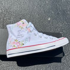 These High Top White Converse have a floral wreath going around your name and date on the outside of both shoes. Elegant Floral that you can wear long after your wedding date. Design by Blake Barash. Check out these wedding Chucks in black: https://www.etsy.com/listing/187099514/hand-painted-just-married-converse-black We buy each pair of shoes BRAND NEW. Each pair is made to order, please make sure you put in the correct shoe size before you check out. The ink is permanent and will never come o Spring Wedding High-top Sneakers, Customizable Round Toe Wedding Shoes, Customizable Round Toe Wedding Shoes For Bridal Shower, Wedding Converse Shoes, Custom Slip On Vans, Vans Slip On Black, Custom Converse Shoes, Wedding Vans, Shoe Artwork