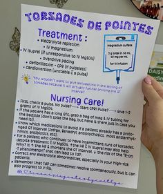 a person holding up a paper with information about nursing care written in purple on it