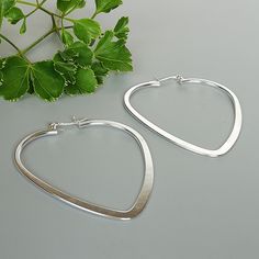 ✦ A PAIR of solid sterling silver heart shaped hoops. ✦ Dimension: 5 x 4.8 cm/ 1.95 x 1.88 inches.    Weight: 9.5gm/ pair Price listed is for a PAIR of hoops. These earrings are made of 925 hypoallergenic sterling silver  Can be packaged in a gift box.  I can include a personal message from you if needed IMPORTANT **Please go through all the pictures i have posted for a listing with a ruler, on a model, on my hand, to get an exact idea of the actual size of the item You are welcome to contact me Minimalist Hoop Earrings For Valentine's Day, Sterling Silver Hoop Earrings For Valentine's Day, Nickel Free Silver Hoop Heart Earrings, Silver Heart Charm Open Heart Hoop Earrings, Nickel-free Heart-shaped Minimalist Hoop Earrings, Silver Hypoallergenic Hoop Heart Earrings, Nickel-free Silver Heart Hoop Earrings, Silver Nickel-free Hoop Heart Earrings, Silver Heart-shaped Hoop Earrings In Sterling Silver