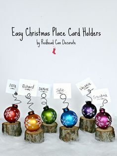 christmas ornaments are lined up on logs in front of a white background with the words easy christmas place card holders