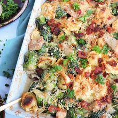 a casserole dish with broccoli, bacon and cheese