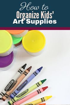 crayons and markers on a table with the title how to organize kids'art supplies