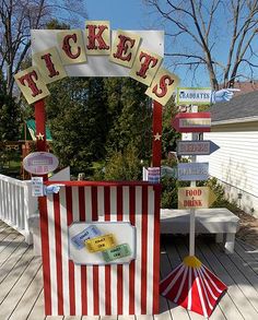 a carnival booth with tickets on it and a sign that says, ticket's