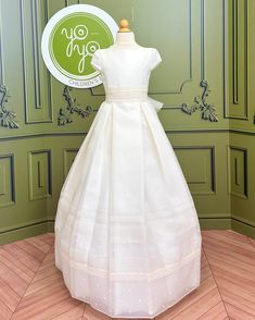 YoYo Boutique First Communion Cala First Communion Dress Elegant A-line Confirmation Dress, Classic Pleated Wedding Dress, Cream Pleated Dress For Wedding, Cream Pleated Wedding Dress, Cream Dresses With Pleated Waist And Fitted Design, White Fitted Dress With Box Pleat, Cream Fitted Dress With Pleated Waist, Elegant Fitted Confirmation Dress, Elegant Fitted Dress For Confirmation