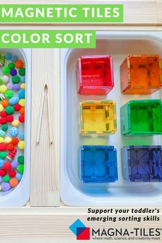 the magnetic tiles color sorter is filled with different colored beads and plastic cubes