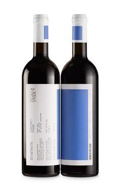 two bottles of red wine are shown side by side on a white background, one is blue and the other is black