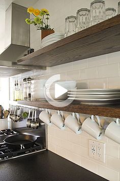 the kitchen counter is clean and ready to be used for cooking or serving dishes,