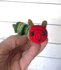 "Oh my gosh, how cute is this little crochet caterpillar? He's made of individual crocheted disks which are threaded onto a chain-stitched body attached to a stuffed head. He's about 4\" long. * The eyes are made with plastic safety-eyes and although quite secure in most cases, safety-eyes are not recommended for children under 3 years of age.  * His antennae are crochet, and his mouth is embroidered.   * Made with easy-care acrylic yarn and is stuffed with a fluffy polyester fiber fill. * Since these are handmade, they may differ slightly than the photos. * Although it could be machine washed (in cold water in a tied-up pillowcase and air dried), hand washing is recommended to extend longevity. * Each piece is lovingly made in a smoke-free and pet-free home with high attention to detail. Tiny Crochet Projects, Cute Gift For Best Friend, Crochet Caterpillar, Crochet Tea Cup, Small Crochet Gifts, Crochet Critters, Crochet Baby Gifts, Baby Toys Diy, Crochet Design Pattern