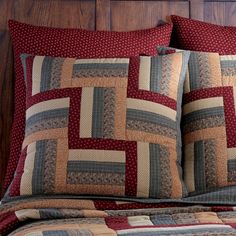 a bed with two pillows on top of it next to a wooden headboard and night stand